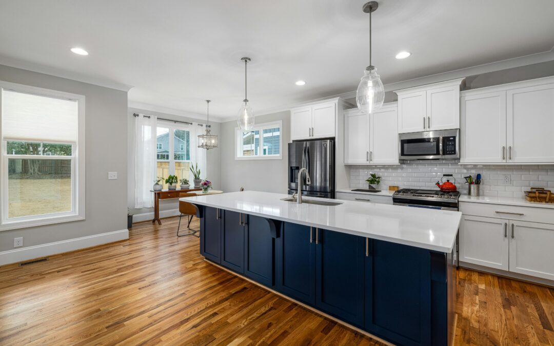 Luxury South Jersey kitchen remodel featuring warm wood cabinetry and a large stone island.